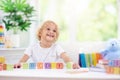 Child learning letters. Kid with wooden abc blocks Royalty Free Stock Photo