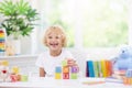 Child learning letters. Kid with wooden abc blocks Royalty Free Stock Photo