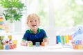 Child learning letters. Kid with wooden abc blocks Royalty Free Stock Photo