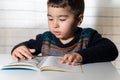 Child learning to read in kindergarten. Royalty Free Stock Photo