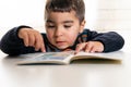 Child learning to read in kindergarten. Royalty Free Stock Photo