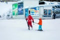 The child learning to ski and instructor