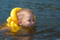 Child is learning to swim