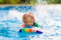 Child learning to swim. Kids in swimming pool Royalty Free Stock Photo