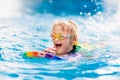 Child learning to swim. Kids in swimming pool Royalty Free Stock Photo