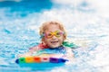 Child learning to swim. Kids in swimming pool Royalty Free Stock Photo