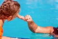 Child learning to swim. Kids in swimming pool