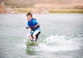 Child learning to wakeboard