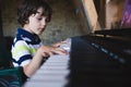 A child learns to play the piano Royalty Free Stock Photo