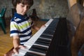 A child learns to play the piano Royalty Free Stock Photo