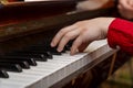 A child learns to play the piano in the lessons at a music school with a teacher. Royalty Free Stock Photo