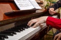 A child learns to play the piano in the lessons at a music school with a teacher. Royalty Free Stock Photo