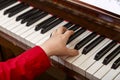 A child learns to play the piano in the lessons at a music school with a teacher. Royalty Free Stock Photo