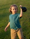 Child lifting the kettlebell in backyard outside. Child boy working out with dumbbells. Kids sport and active healthy Royalty Free Stock Photo