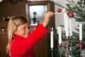 Child lighting Christmas candles