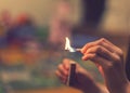 The child lighting the matches. The fire in the hands of a child. A small child plays with matches, a fire, a fire Royalty Free Stock Photo