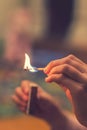 The child lighting the matches. The fire in the hands of a child. vertical photo. toned Royalty Free Stock Photo