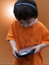 Child Listening To Music - Orange Royalty Free Stock Photo