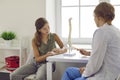 Child listens from doctor about structure of spinal human vertebrae at orthopedic clinic appointment