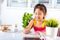 Child little girl drawing cartoon on paper before paint the color Royalty Free Stock Photo