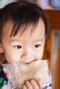 Child little girl eating sticky rice