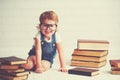 Child little girl with glasses reading a books Royalty Free Stock Photo