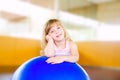 Child little girl with gym aerobics ball Royalty Free Stock Photo