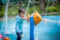 Child little girl having fun to play with water in park fountain Royalty Free Stock Photo