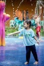 Child little girl having fun to play with water in park fountain Royalty Free Stock Photo