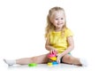 Child little girl playing with color toys Royalty Free Stock Photo