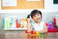 Child little girl playing wooden toys Royalty Free Stock Photo