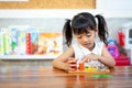 Child little girl playing wooden toys Royalty Free Stock Photo