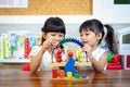 Child little girl playing wooden toys Royalty Free Stock Photo