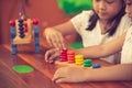 Two child little girl playing wooden toys Royalty Free Stock Photo