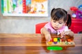 Child little girl playing wooden toys Royalty Free Stock Photo