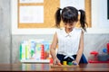 Child little girl playing wooden toys Royalty Free Stock Photo