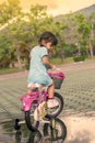 Child little girl riding bike in park Royalty Free Stock Photo