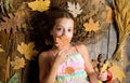 Child long hair with dry leaves. Tips for turning autumn into best season. Autumn coziness is just around. Coziest