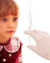 Child look at hand with syringe. Royalty Free Stock Photo