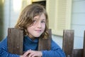 Child looking through bars of fence Royalty Free Stock Photo