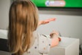 Child looking at a big television screen, playing a game Royalty Free Stock Photo