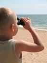 Child looking through binoculars