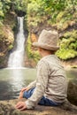 Child looking Chamouze waterfall. Mauritius Royalty Free Stock Photo