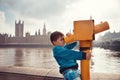Child looking through coin operated binoculars Royalty Free Stock Photo