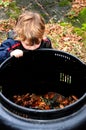 Child looking in compost bin Royalty Free Stock Photo