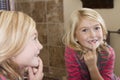 Child looking in mirror at missing front tooth Royalty Free Stock Photo