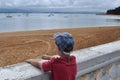 Child looking at the sea