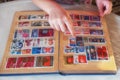 The child looks album with stamps Royalty Free Stock Photo