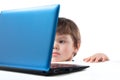 The child looks at the computer