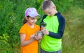 The child looks at the snail. Selective focus. Royalty Free Stock Photo